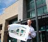 Liberty Lake Portal leasing agent Steven Daines holds a plan for the expansion of the building on Mission Avenue scheduled for this summer. The Portal now houses nearly 40 businesses in 86,000 square feet of space.

